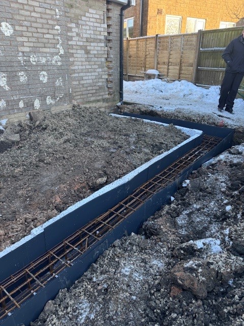 piling in Hapton Way, Rossendale in the snow